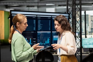 goals-oriented-businesswomen-dive-deep-into-financial-reports-leveraging-graphs-indicators-1